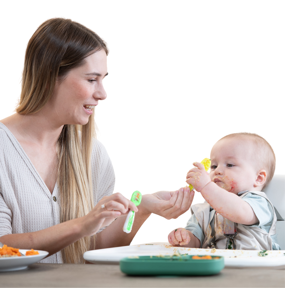 woman feeding a baby