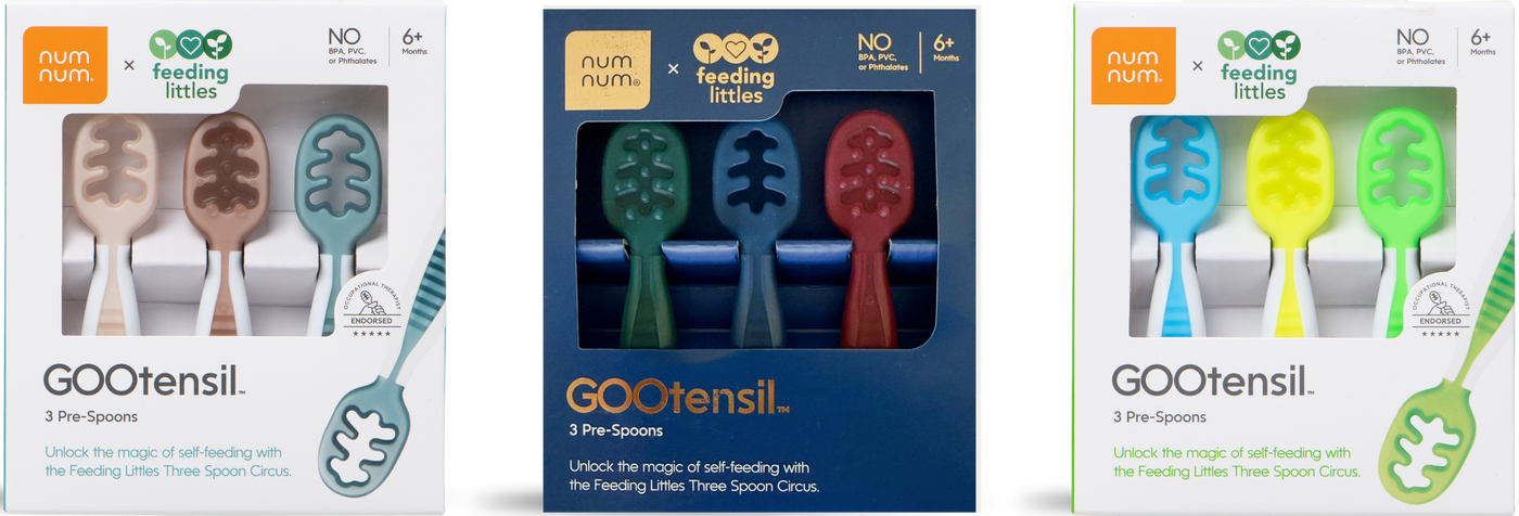 Three packages of GOOtensil feeding utensils in different colors.