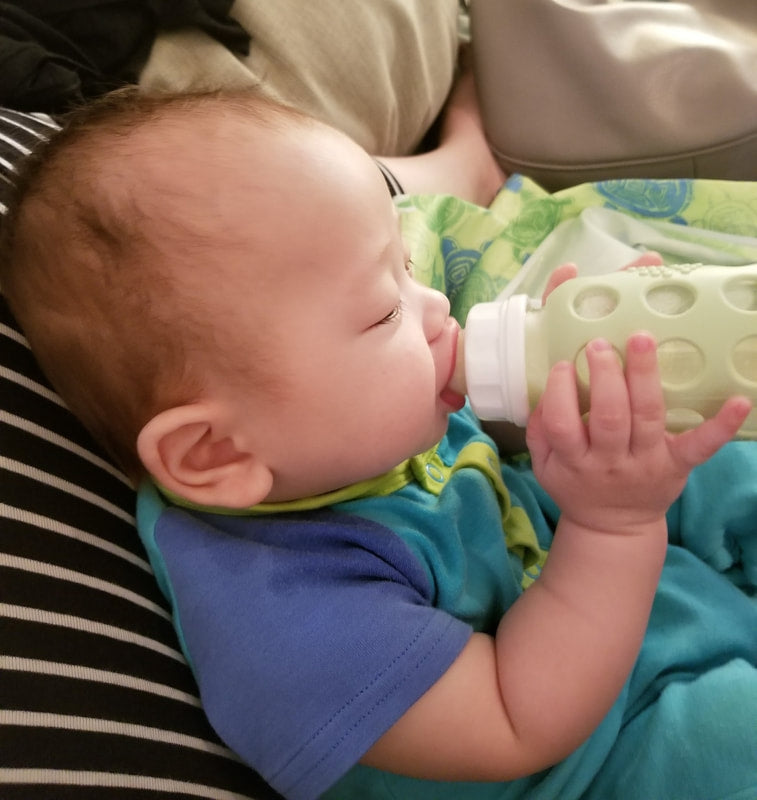 should-my-baby-hold-their-own-bottle-feeding-littles